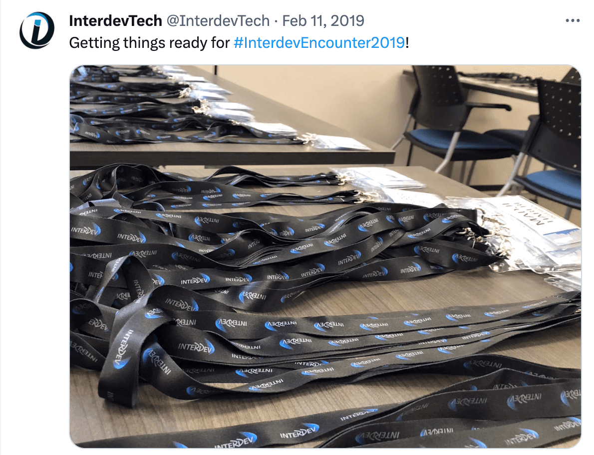 A tweet by @InterdevTech with an image of Interdev's lanyards on a table.